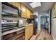 A modern kitchen with stainless steel appliances and wood cabinets at 2006 N Ocean Blvd. # 876, Myrtle Beach, SC 29577