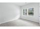 Neutral bedroom with carpet, white walls and window at 2024 Copper Creek Loop, Longs, SC 29568