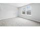 Neutral bedroom with carpet, white walls and a double window at 2024 Copper Creek Loop, Longs, SC 29568