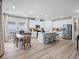 Spacious kitchen featuring stainless steel appliances, a central island with seating, and adjacent dining area at 2024 Copper Creek Loop, Longs, SC 29568