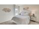 Tranquil bedroom featuring soft, neutral tones, plush bedding, and a mirrored nightstand at 2032 Copper Creek Loop, Longs, SC 29568