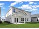 Exterior view of the house with a covered patio and a well-manicured lawn at 2044 Copper Creek Loop, Longs, SC 29568