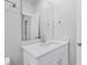 Bathroom with a vanity, granite countertop, and a large, well-lit mirror at 2044 Copper Creek Loop, Longs, SC 29568