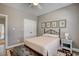 Bedroom with closet and a comfortable bed with soft furnishings at 221 Portrush Loop, Pawleys Island, SC 29585