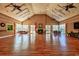 Spacious clubhouse featuring a fireplace, ample seating, and hardwood floors at 221 Portrush Loop, Pawleys Island, SC 29585