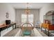 Dining room with a wooden table, six chairs and a light fixture above the table at 221 Portrush Loop, Pawleys Island, SC 29585