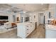 Bright kitchen features a center island with a marble countertop and modern stainless steel appliances at 221 Portrush Loop, Pawleys Island, SC 29585