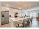 Modern kitchen island with quartz countertop, seating, and stainless steel appliances at 221 Portrush Loop, Pawleys Island, SC 29585