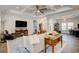 Bright living room with hardwood floors, large sofa, and decorative fireplace at 221 Portrush Loop, Pawleys Island, SC 29585