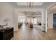 Open layout showcasing hardwood floors connecting the entryway to the living spaces at 221 Portrush Loop, Pawleys Island, SC 29585