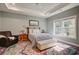 Main bedroom featuring a colorful rug, large window, bench and an armchair at 221 Portrush Loop, Pawleys Island, SC 29585