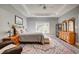 Spacious main bedroom with tray ceiling and a patterned rug at 221 Portrush Loop, Pawleys Island, SC 29585