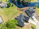 An aerial view shows the roof and front entrance next to a pond at 227 Old Hickory Dr., Conway, SC 29526