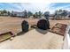 Backyard area with a concrete patio and views of a tranquil pond and green landscaping at 227 Old Hickory Dr., Conway, SC 29526