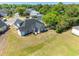An aerial view shows a lovely backyard with a patio and landscaping at 227 Old Hickory Dr., Conway, SC 29526