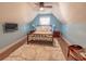 A cozy bedroom has a metal frame bed on a plush rug and under a vaulted ceiling at 227 Old Hickory Dr., Conway, SC 29526