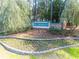 Community entrance featuring Hillsborough signage amidst beautiful landscaping, stone, and flowerbeds at 227 Old Hickory Dr., Conway, SC 29526