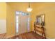 Bright foyer with a wooden floor, stylish console table and elegant lighting fixture at 227 Old Hickory Dr., Conway, SC 29526