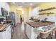 Bright kitchen featuring white cabinets, wood countertops, stainless steel appliances, and bar seating at 227 Old Hickory Dr., Conway, SC 29526