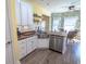 Modern kitchen featuring white cabinets, butcher block countertops, stainless steel appliances, and a breakfast nook at 227 Old Hickory Dr., Conway, SC 29526