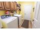 Laundry room with modern washer and dryer machines and storage cabinets at 227 Old Hickory Dr., Conway, SC 29526