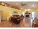 Warm and inviting living room with hardwood floors, a stone fireplace, and nautical decorations at 227 Old Hickory Dr., Conway, SC 29526