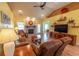 Comfortable living room with a stone fireplace, wood floors, and plenty of natural light at 227 Old Hickory Dr., Conway, SC 29526