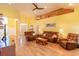 Spacious living room featuring wood floors, comfortable seating, and a vaulted ceiling with nautical decor at 227 Old Hickory Dr., Conway, SC 29526