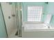 Spa-like bathroom with a glass-enclosed shower and a relaxing soaking tub with jacuzzi jets at 227 Old Hickory Dr., Conway, SC 29526