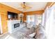 Comfortable sun room with a ceiling fan, a tile fireplace, and large windows for lots of natural light at 227 Old Hickory Dr., Conway, SC 29526