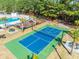 Aerial shot featuring tennis/pickle ball court and nearby pool and playground at 227 Old Hickory Dr., Conway, SC 29526