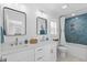 Bright bathroom featuring a double sink vanity, modern fixtures, and blue tile accent wall at 2306 Seaseeker Ln., Myrtle Beach, SC 29577