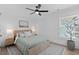 Cozy bedroom with a queen bed, stylish rug, and windows providing ample light at 2306 Seaseeker Ln., Myrtle Beach, SC 29577