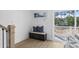 Hallway nook with bench, art, and access to outdoor balcony with vinyl railing at 2306 Seaseeker Ln., Myrtle Beach, SC 29577