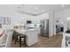 Modern kitchen featuring white cabinets, stainless steel appliances, and breakfast bar at 2306 Seaseeker Ln., Myrtle Beach, SC 29577