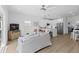 Open floor plan living room with modern furniture, TV, and natural light at 2306 Seaseeker Ln., Myrtle Beach, SC 29577