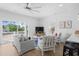 Bright living room with coastal decor, ceiling fan, and access to outdoor balcony at 2306 Seaseeker Ln., Myrtle Beach, SC 29577