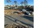 An overview of the neighborhood with a white pickup truck on the street and trees lining the area at 2306 Seaseeker Ln., Myrtle Beach, SC 29577