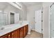 Bathroom features a double sink vanity with cabinets, mirror, and glass shower at 2454 N Windmill Way, Myrtle Beach, SC 29579