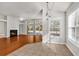 Bright living room featuring a fireplace, ceiling fan, and large windows for plenty of natural light at 2454 N Windmill Way, Myrtle Beach, SC 29579