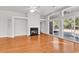 Spacious living room with a fireplace, sliding glass doors to the patio, and hardwood flooring at 2454 N Windmill Way, Myrtle Beach, SC 29579