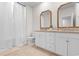 Bathroom featuring double sink vanities, and a tub with a curtain at 2602 Blue Crane Circle # 104, Myrtle Beach, SC 29577