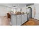 Bright kitchen island featuring granite countertops, stainless steel appliances, and stylish furnishings at 2602 Blue Crane Circle # 104, Myrtle Beach, SC 29577