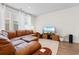 Comfortable living room featuring a plush leather sofa, TV, and natural light at 2602 Blue Crane Circle # 104, Myrtle Beach, SC 29577