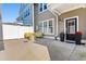 Inviting patio area with comfortable seating and a stylish outdoor fire pit, perfect for relaxing and entertaining at 2602 Blue Crane Circle # 104, Myrtle Beach, SC 29577