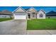 Attractive home with a two-car garage, manicured lawn, and a welcoming entrance, creating a warm and inviting curb appeal at 269 Leste Rd., Myrtle Beach, SC 29588