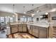 Open concept kitchen with stainless steel appliances, gray cabinets, quartz countertop, and hardwood floors at 269 Leste Rd., Myrtle Beach, SC 29588