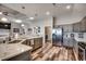 Spacious kitchen with stainless steel appliances, gray cabinets, quartz countertop, and hardwood floors at 269 Leste Rd., Myrtle Beach, SC 29588