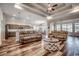 Spacious living room with hardwood floors, a tray ceiling with recessed lights, and open access to the kitchen at 269 Leste Rd., Myrtle Beach, SC 29588