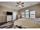 A bright bedroom featuring hardwood floors, a ceiling fan, and natural light at 269 Leste Rd., Myrtle Beach, SC 29588